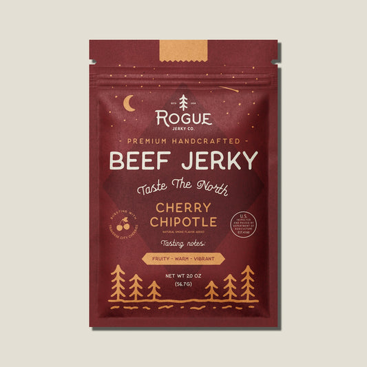 Packaging of Rogue Beef Jerky Cherry Chipotle flavor on a beige background