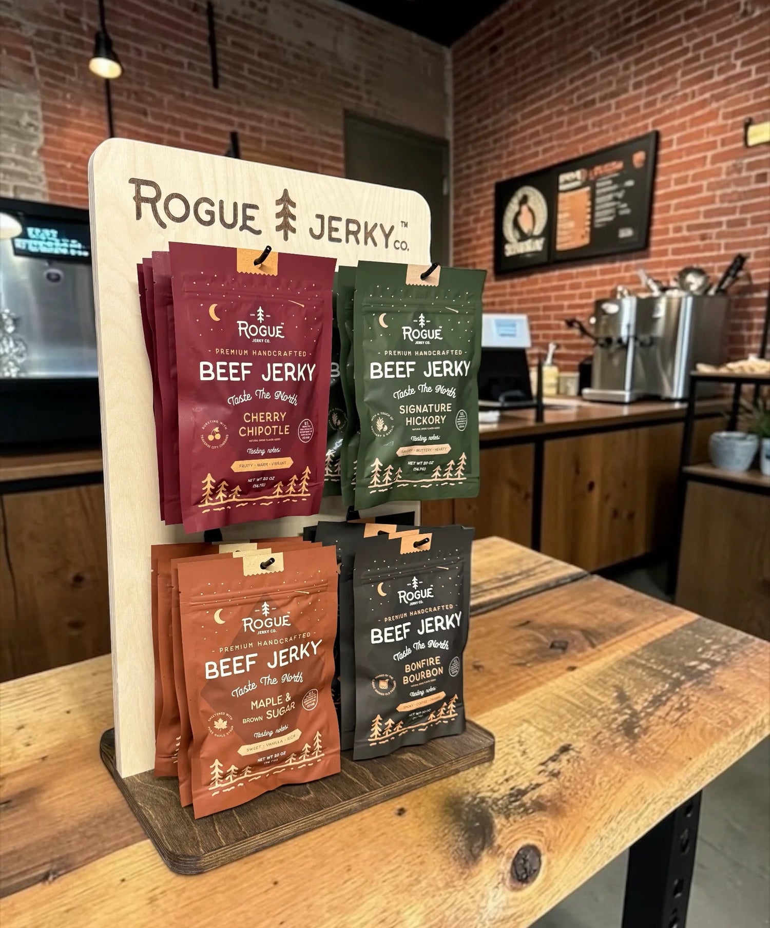 Rogue Jerky packaging displayed on a stand in a kitchen setting